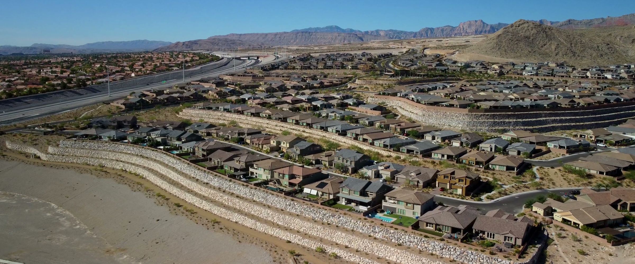 Las Vegas neighborhood from above with desert mountains behind