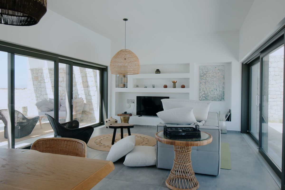 Bright open living room with sliding glass walls